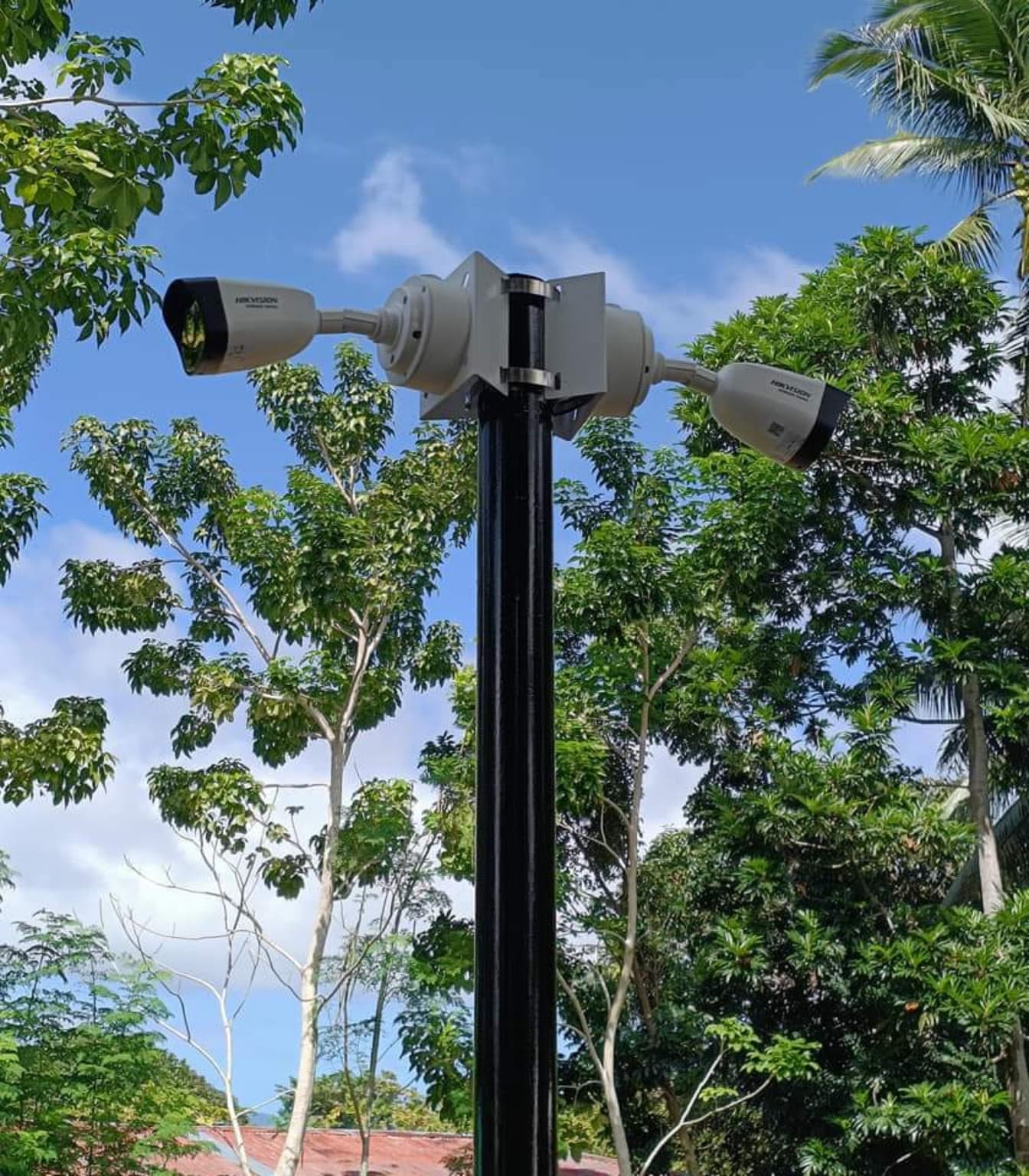 Dual CCTV camera heads mounted on a pole